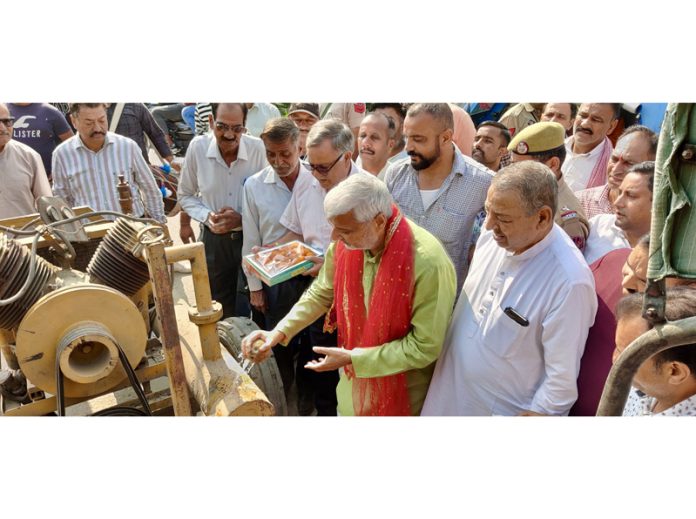 MLA North, Sham Lal Sharma inaugurating macadamization of road from Muthi to Akalpur Chowk on Wednesday.