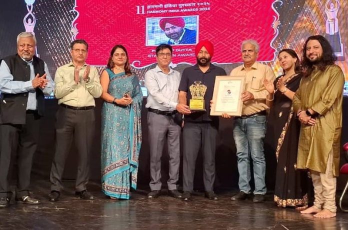 Senior journalists Pardeep Dutta and Ashwani Kumar being presented Harmony India Awards 2025 at Jammu on Saturday.
