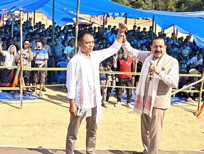 Union Minister Dr Jitendra Singh, raising the hand of BJP candidate, while addressing a public rally at the far-flung area of Silsuri, district Mamit, Mizoram on Thursday.