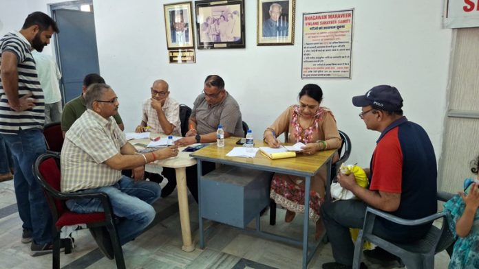 People being examined for artificial limbs at the free camp on Sunday.