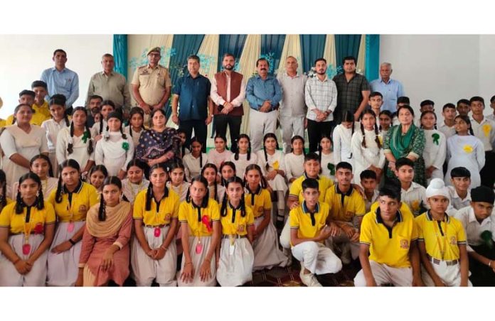 Participating students with guests and organizers during lecture on 'National Security' held on National Unity Day.
