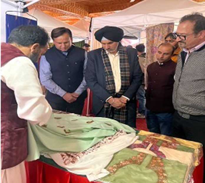 Comm Secy Industries & Commerce visiting a stall at Buyer-Seller Meet at Budgam on Friday.