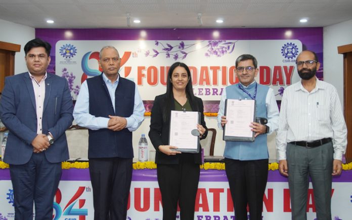 Director CSIR displaying copy of MoU signed on occasion of Foundation Day.