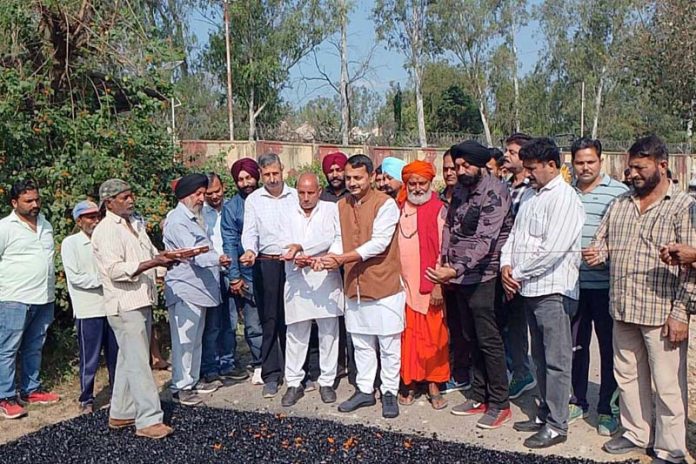 MLA R S Pathania kick-starting restoration work of damaged road at Rakh Badali area of Udhampur.