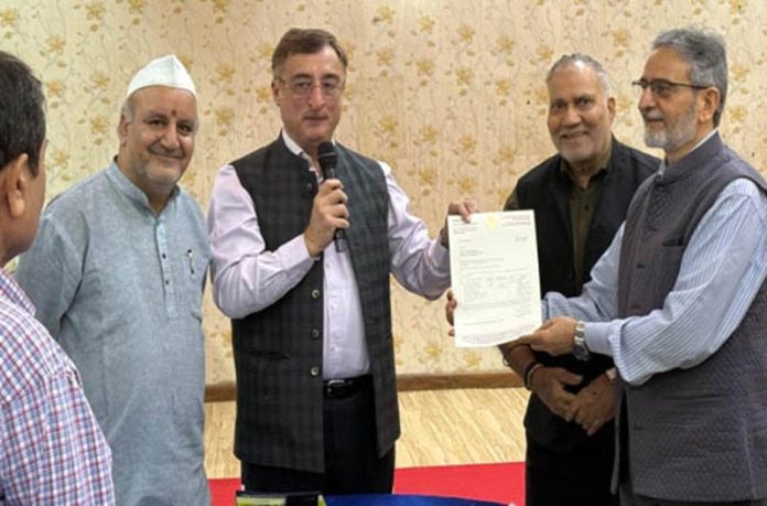 MP (RS), Vivek Tankha handing over a letter to KECSS representatives regarding grant of Rs 10 lac from his MP LAD fund for construction of Cultural Centre in New Delhi on Monday