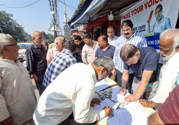 Cong leaders during signature campaign in Jammu East on Sunday. Cong leaders during signature campaign in Jammu East on Sunday.