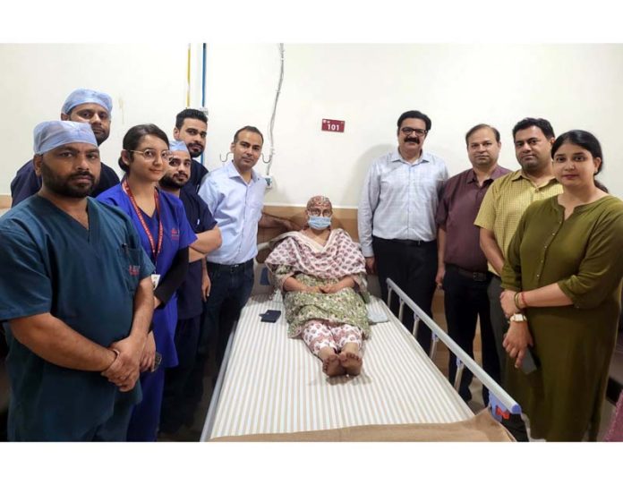 A team of doctors posing with a cancer patient on whom they perform HIPEC procedure in AOI Jammu.