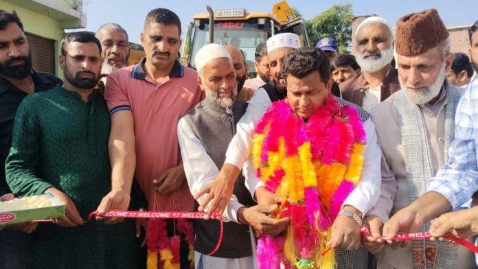 MLA Rajouri, Iftikhar Ahmed kick-starting blacktopping work on Kheora-Choudhary Nar road on Sunday. -Excelsior/Imran