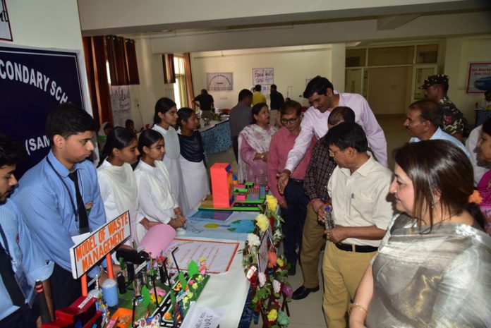 Shantmanu inspecting innovative models at science exhibition by SCERT.