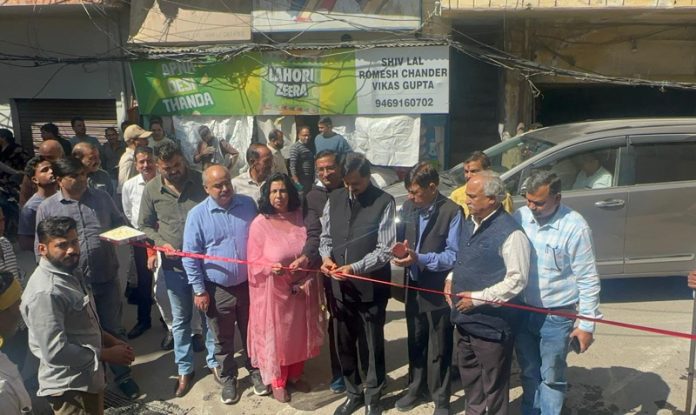 MLA Pawan Gupta inaugurating blacktopping work on the road from Pachala Chowk to Forest Office.