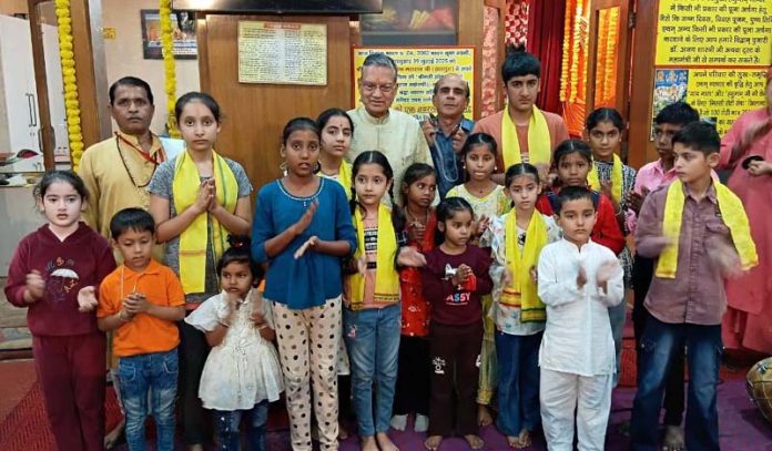 Students with JYBT president, Pawan Shastri and others at Vedic Pathshala in Jammu on Sunday.