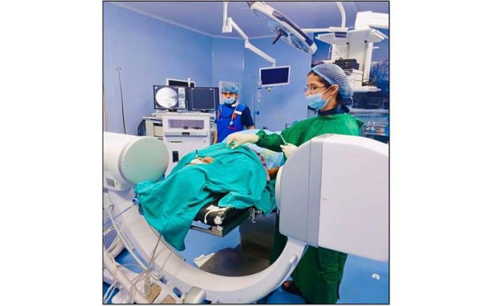 A doctor performing RFA procedure on a patient at AIIMS Jammu.