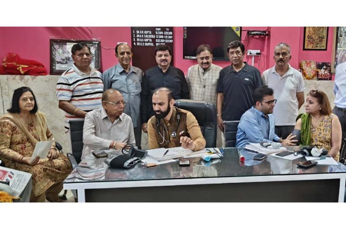 HoD Cardiology GMC & SSH Jammu Dr Sushil Sharma examining patients at Trikuta Nagar on Sunday.