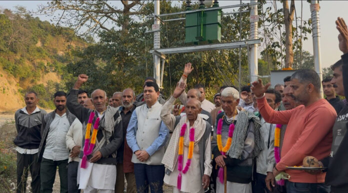 DDC Member Pt Suresh Sharma with villagers after inaugurating a new power transformer at village Chang, Chowki Choura in Akhnoor.