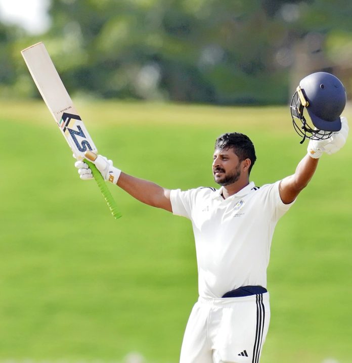 Shubham Khajuria raising his bat after scoring his unbeaten 190 runs against Chhattisgarh.