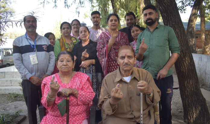 Migrants after casting their votes at Camp School Nagrota, Jammu onTuesday. -Excelsior/Rakesh
