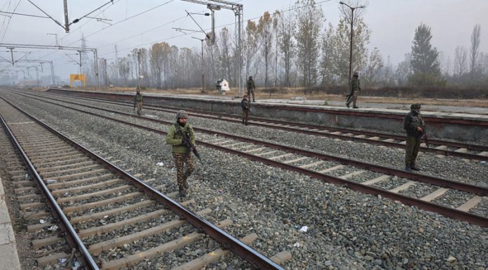 Security personnel on high alert at railway track in Sopore on Tuesday. -Excelsior/Aabid Nabi Security personnel on high alert at railway track in Sopore on Tuesday. -Excelsior/Aabid Nabi
