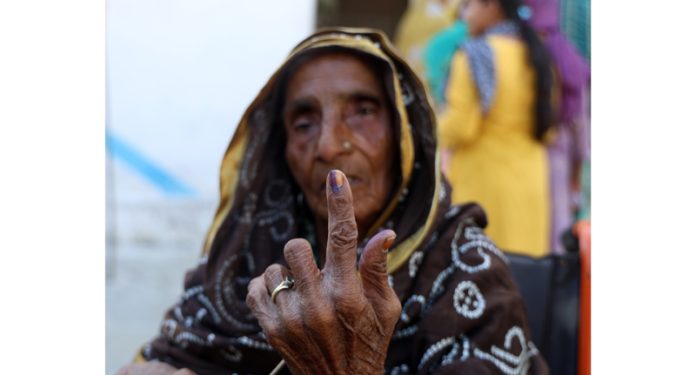 An elderly woman shows her inked finger after casting vote in Nagrota by-poll. -Excelsior/Rakesh An elderly woman shows her inked finger after casting vote in Nagrota by-poll. -Excelsior/Rakesh