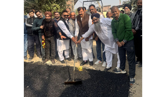 MLA Jammu West, Arvind Gupta kick starting blacktopping of road in Ranjitpur Panchayat on Monday.
