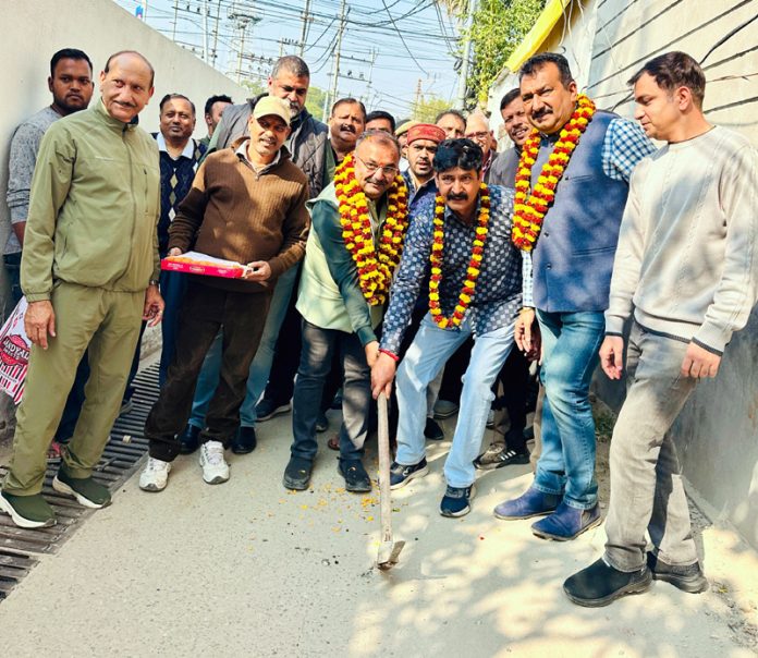 MLA Bahu, Ch Vikram Randhawa kick starting the construction of lane in Satwari area on Wednesday.