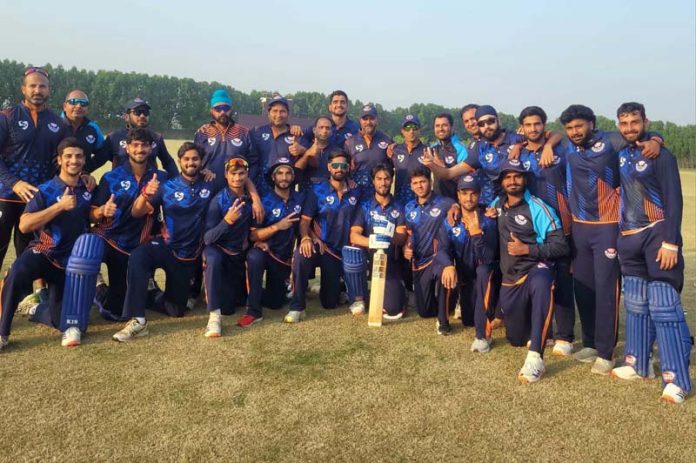J&K team posing for group photograph after winning match.
