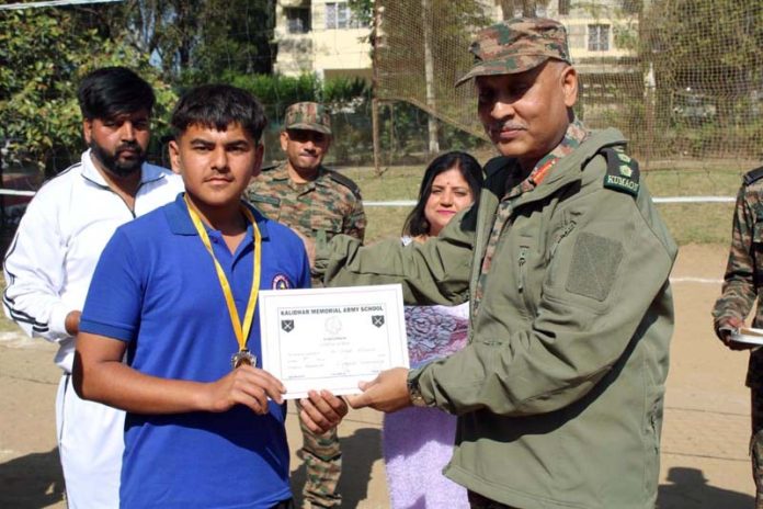 An Army officer presenting certificate to a player.