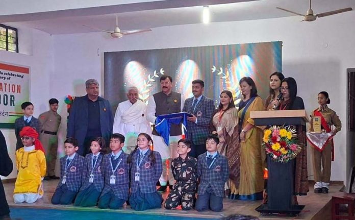 Students along with dignitaries posing during a programme. Students along with dignitaries posing during a programme.