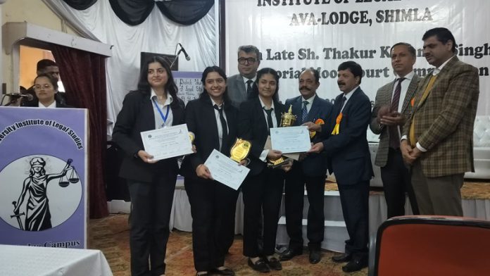 Dogra Law College students receiving certificates and trophy from dignitaries. Dogra Law College students receiving certificates and trophy from dignitaries.