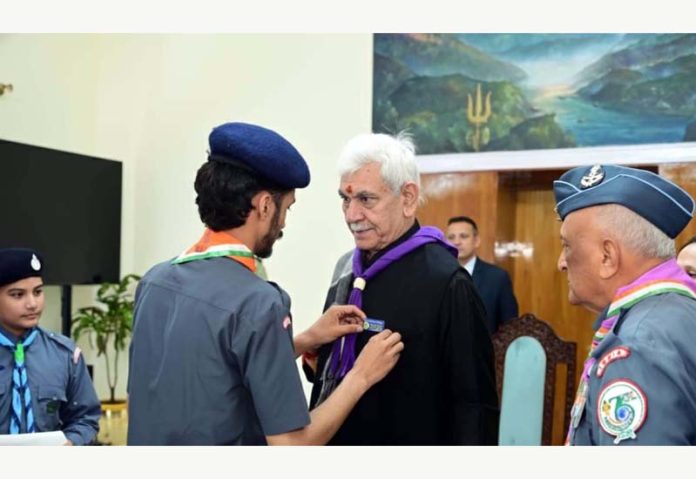 A representative of the Scouts & Guides organization pinning a sticker flag on LG Manoj Sinha at Raj Bhawan on Saturday. A representative of the Scouts & Guides organization pinning a sticker flag on LG Manoj Sinha at Raj Bhawan on Saturday.