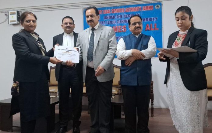 A panel lawyer being awarded a certificate at a programme organized by DLSA Jammu.