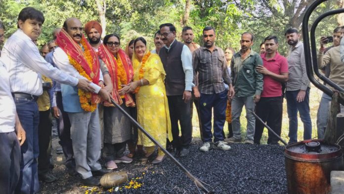 MLA Akhnoor, Mohan Lal Bhagat starting road blacktopping work in his Constituency on Sunday. MLA Akhnoor, Mohan Lal Bhagat starting road blacktopping work in his Constituency on Sunday.