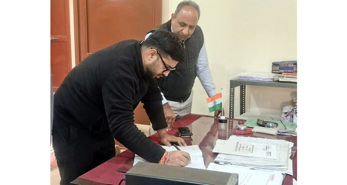 DC Rajouri inspecting record of an office on Monday. DC Rajouri inspecting record of an office on Monday.