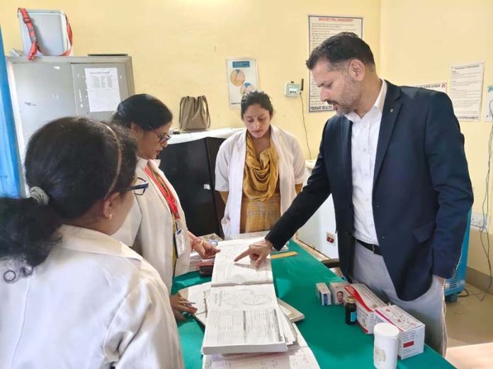 DHSJ Dr Abdul Hamid Zargar inspecting records at PHC Pouni in Reasi district.