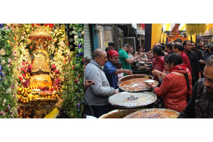 Volunteers serving devotees at ancient Kaal Bhairav temple in Jammu on Thursday. -Excelsior/Rakesh
