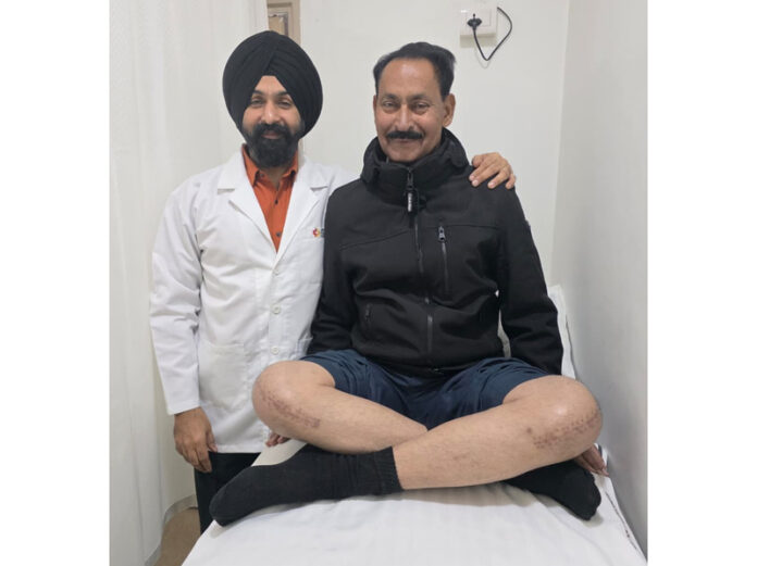 Dr Ranjit Singh posing with a patient on whom he performed knee replacement surgery.
