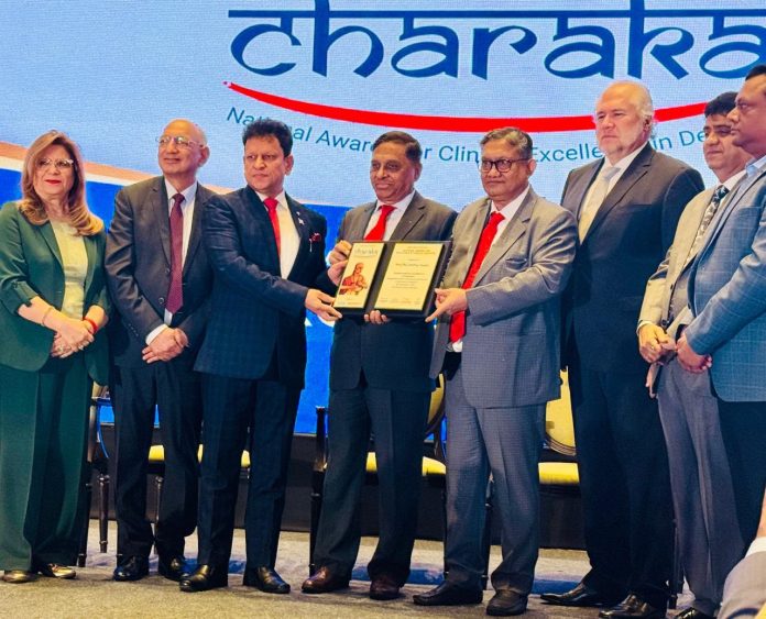 Dr Akshay Gupta receiving Charak Award at a ceremony in Mumbai.