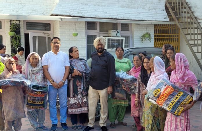 Congress leader, Taranjit Singh Tony along with others posing for a group photograph after distributing blankets to flood hit families in Jammu. Congress leader, Taranjit Singh Tony along with others posing for a group photograph after distributing blankets to flood hit families in Jammu.