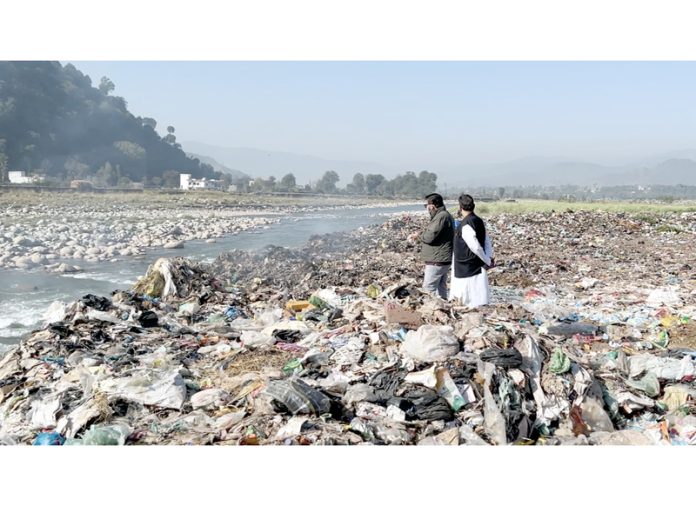 City garbage dumped at the bank of river in Poonch.