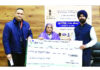 DC Doda handing over a cheque to a beneficiary in the town on Friday.