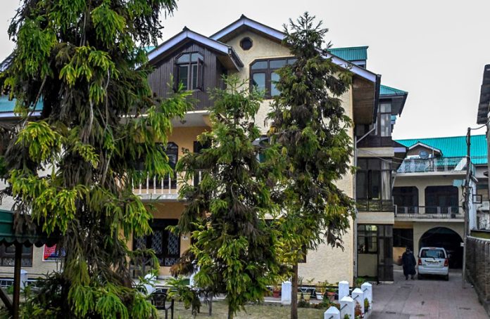 JKP attached property of former J&K High Court Bar Association president Mian Abdul Qayoom under UAPA in Srinagar. -Excelsior photo JKP attached property of former J&K High Court Bar Association president Mian Abdul Qayoom under UAPA in Srinagar. -Excelsior photo