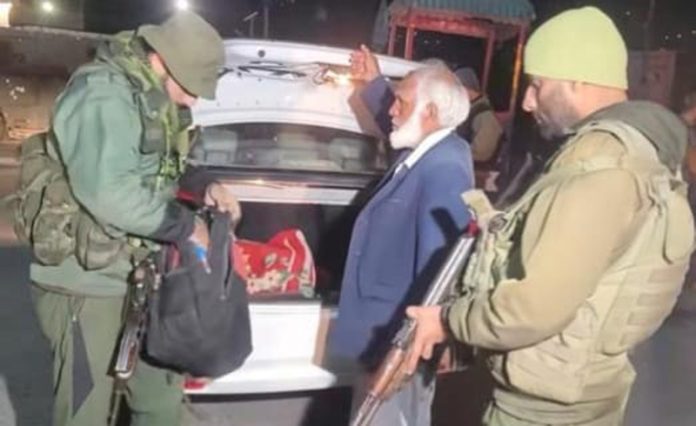 Security personnel check a vehicle in Rajouri on Wednesday. -Excelsior/Imran