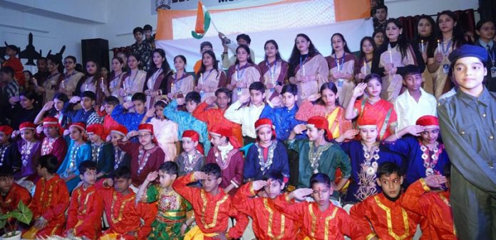 DBN school students posing for group photograph along with dignitaries during an Annual Day event.