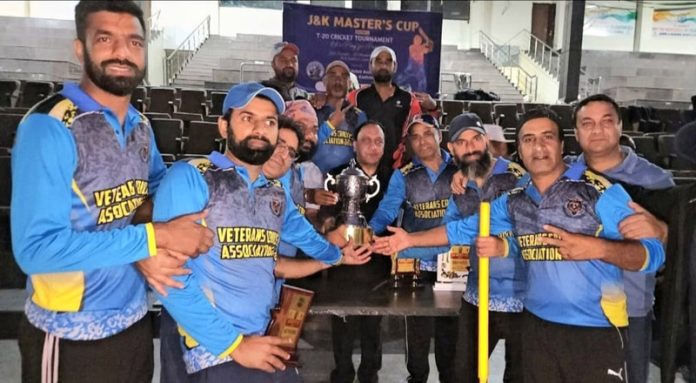 Winning teams receiving title trophy of J&K Master’s Cup T20 Cricket Championship from the chief guest.