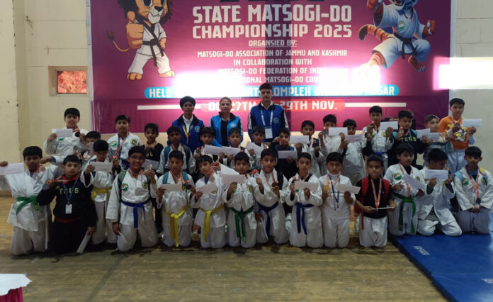 Athletes posing along with dignitaries during a programme. Athletes posing along with dignitaries during a programme.