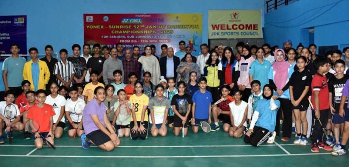 Badminton players posing along with dignitaries during inaugural ceremony.