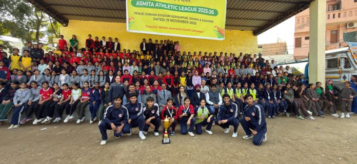Girls athletes posing for group photograph along with dignitaries.