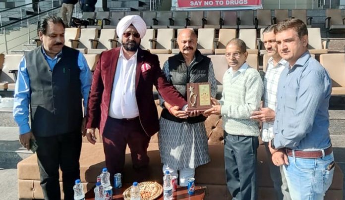 Management presenting memento to dignitaries.