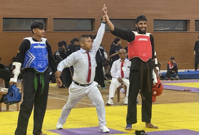 A J&K player being declared winner of a bout by the match referee during the National Thang-Ta Championship in Goa. A J&K player being declared winner of a bout by the match referee during the National Thang-Ta Championship in Goa.