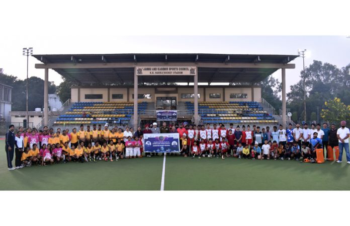 Hockey teams posing during a programme. Hockey teams posing during a programme.