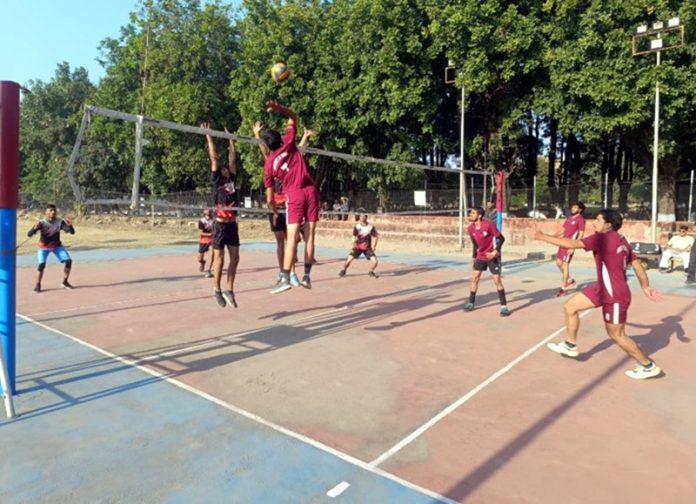 Players in action during a Volleyball match.
